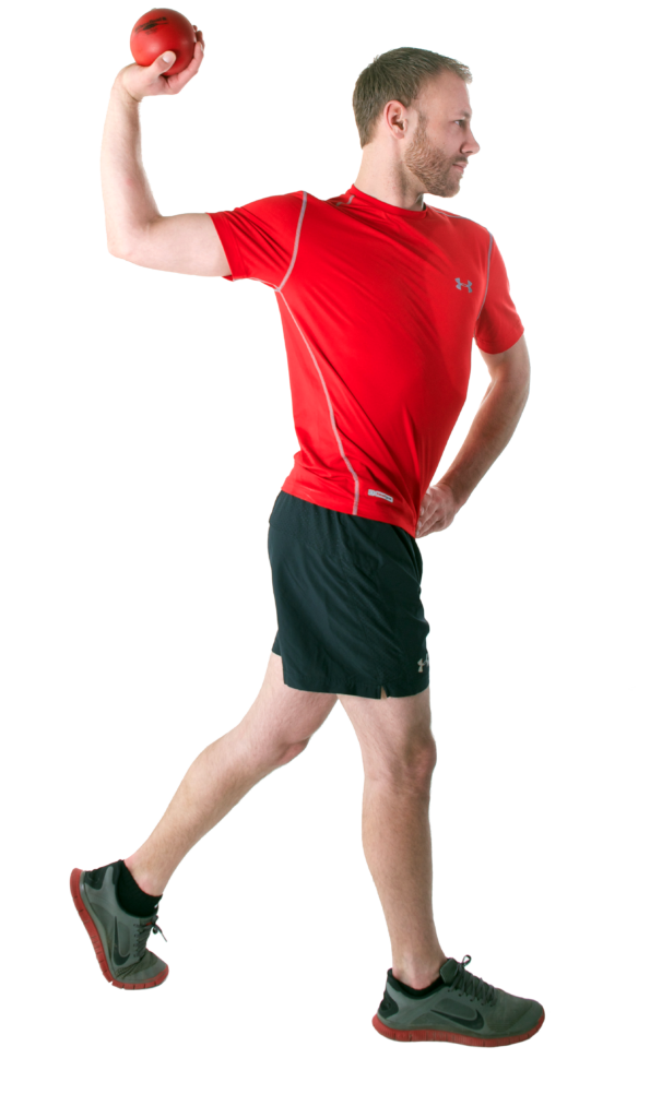 Man in red shirt throwing a ball