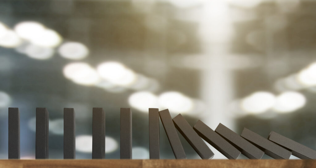 Falling domino blocks on blurred background