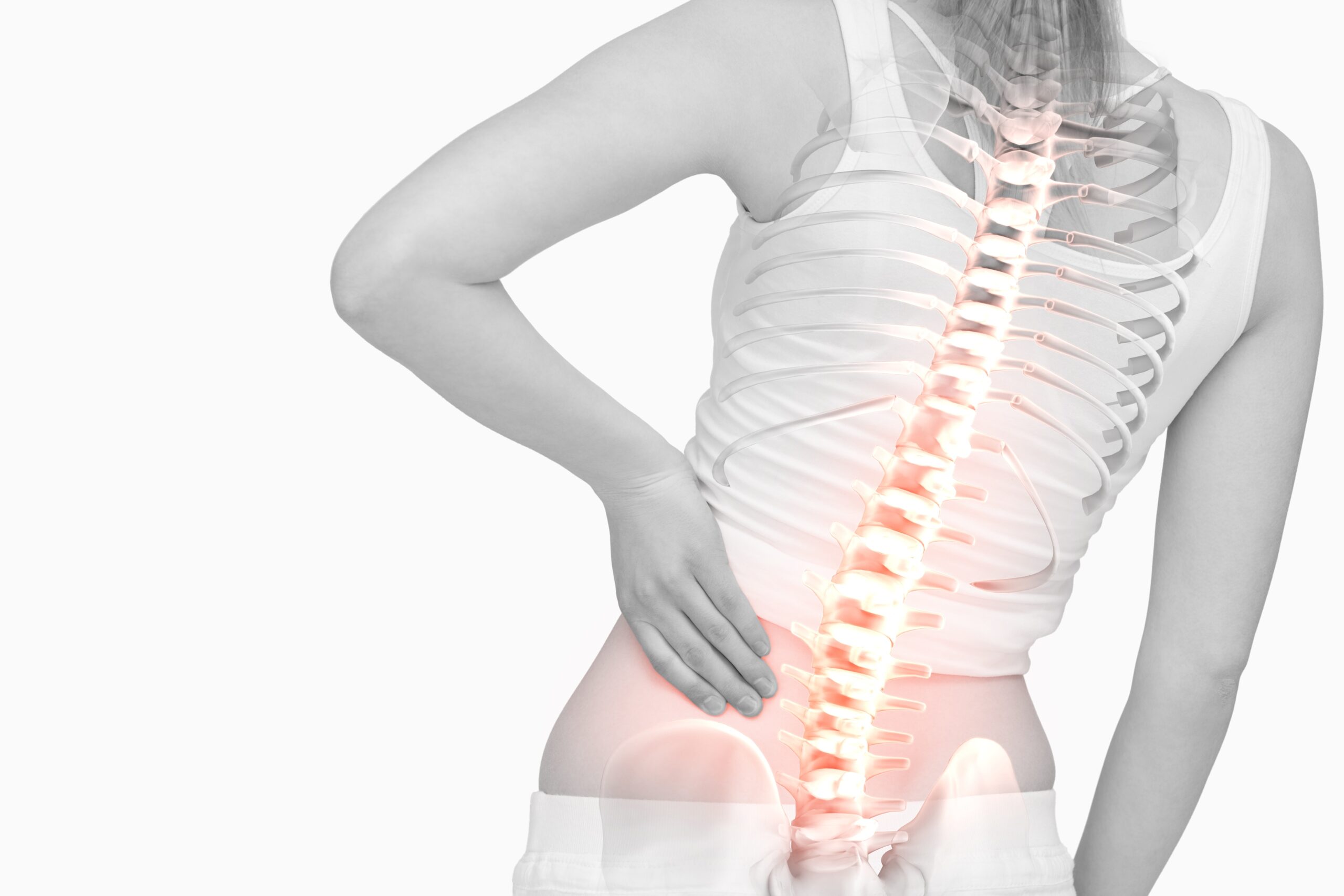 Woman with spine pain, holding lower back
