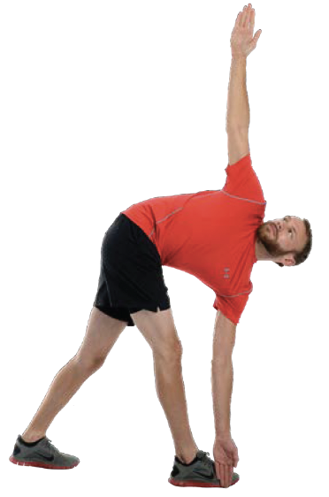 Man performing a standing yoga stretch.