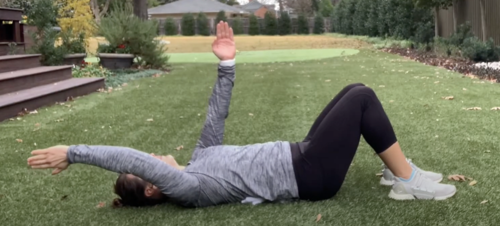 Person doing outdoor exercise on grass